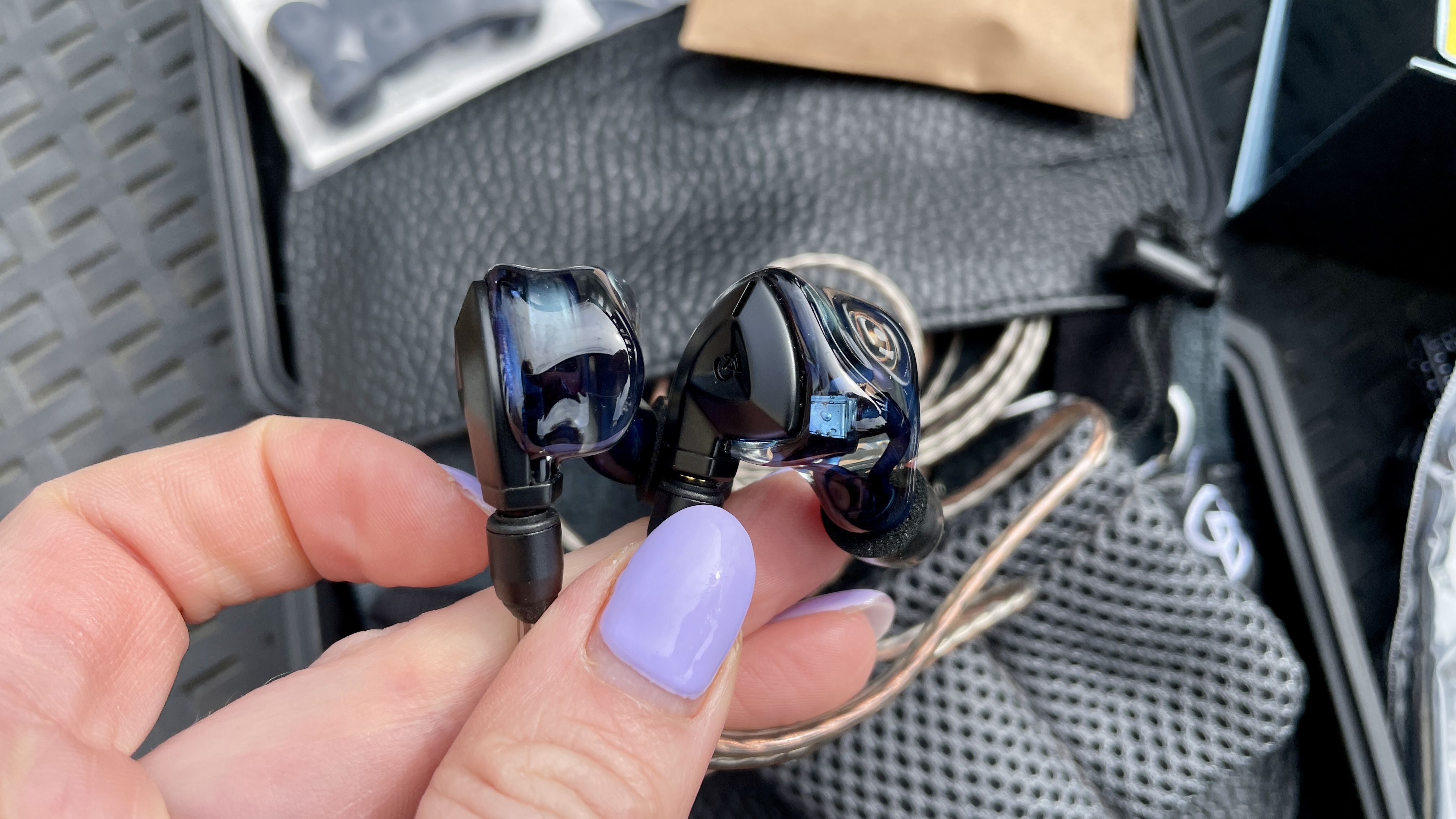 Campfire Audio Clara held in a hand, or worn by a woman