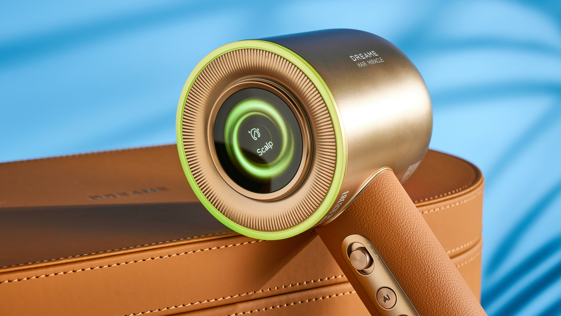 the dreame miracle pro hair dryer in gold showing the storage box on the blue tom's guide background, with the four attachment nozzles including two blow-drying nozzles, diffuser, and the flyaway tamer