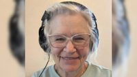 An image of GrammaCrackers, smiling and wearing headphones.