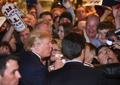 Donald Trump mingles in a crowd of supporters at a Las Vegas rally