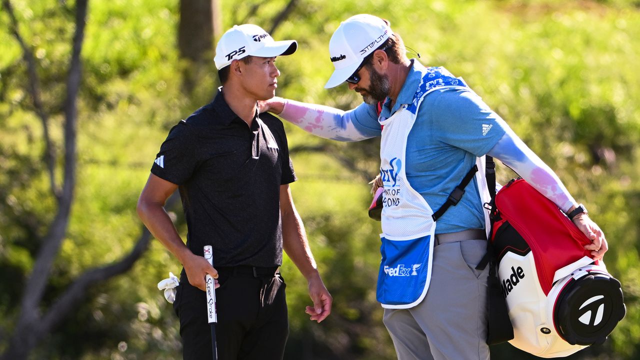 Collin Morikawa is consoled by his caddie at Kapalua