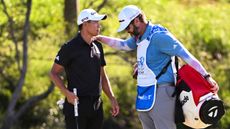 Collin Morikawa is consoled by his caddie at Kapalua