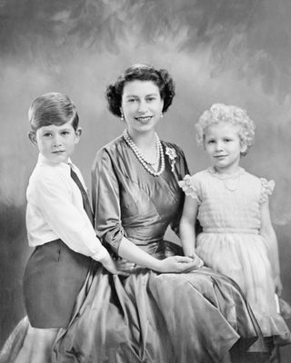 King Charles and Princess Anne strike a pose with their mother