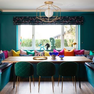 u shaped turquoise kitchen booth with colourful cushions