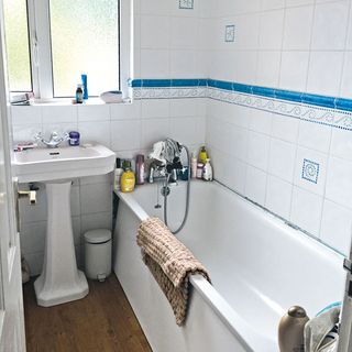 white washbasin with bathtub and washbasin