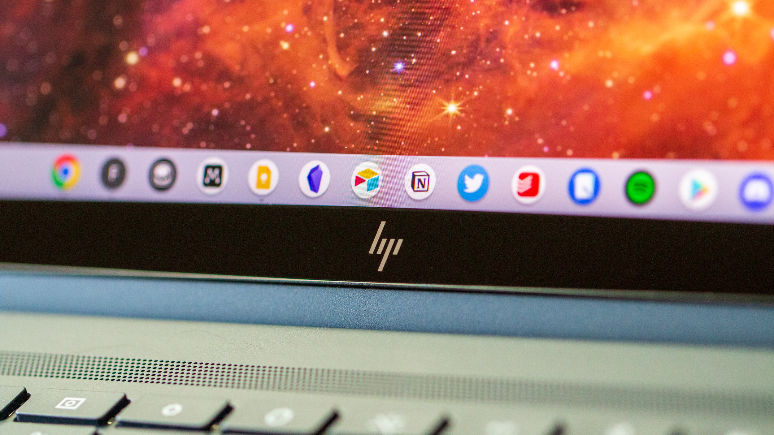 HP Elite Dragonfly Chromebook close-up on small HP logo under screen