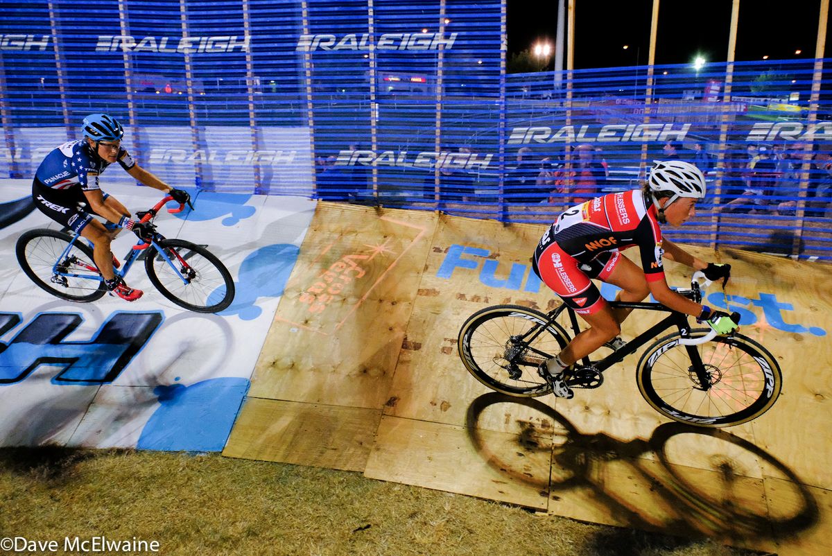 Sophie De Boer leading Katie Compton around the banked track.