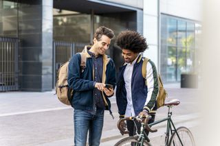 Two men meeting up as rules change on how many people can meet outside and indoors