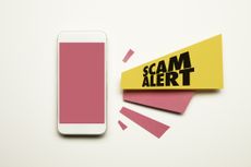 scam alert next to cell phone for IRS email scams story