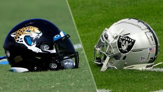 (L to R) the Jaguars and Raiders helmets on the football field