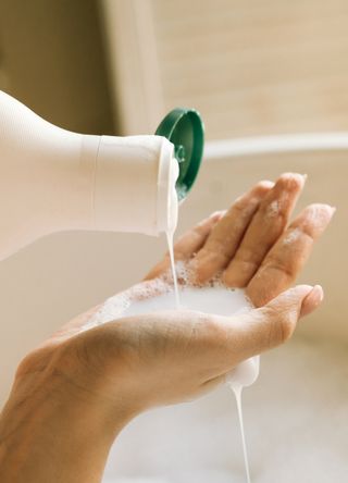 Woman using shampoo