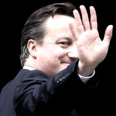 LONDON, ENGLAND - MAY 10:British Prime Minister David Cameron waves as he enters Number 10 Downing Street on May 10, 2012 in London, England. Andy Coulson, a former editor of the News of the 