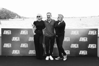 VENICE, ITALY - SEPTEMBER 05: (EDITORS NOTE: Image has been converted to black and white.) Lady Gaga, Director Todd Phillips and Joaquin Phoenix attend the "Joker: Folie À Deux" photocall during the 81st Venice International Film Festival at Cipriani Hotel on September 05, 2024 in Venice, Italy.