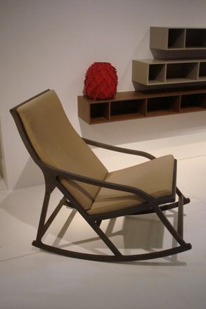 A brown rocker chair.