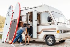 Older couple outside a RV