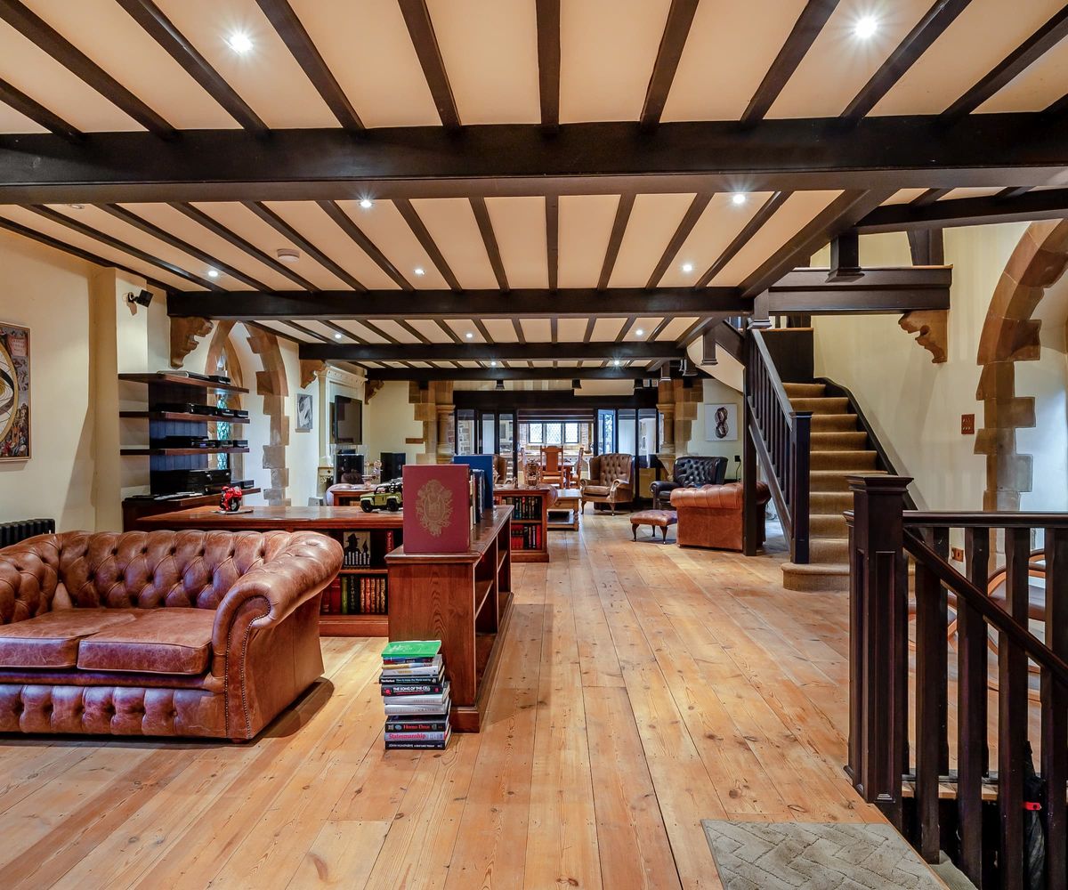 A large reception room with exposed beams