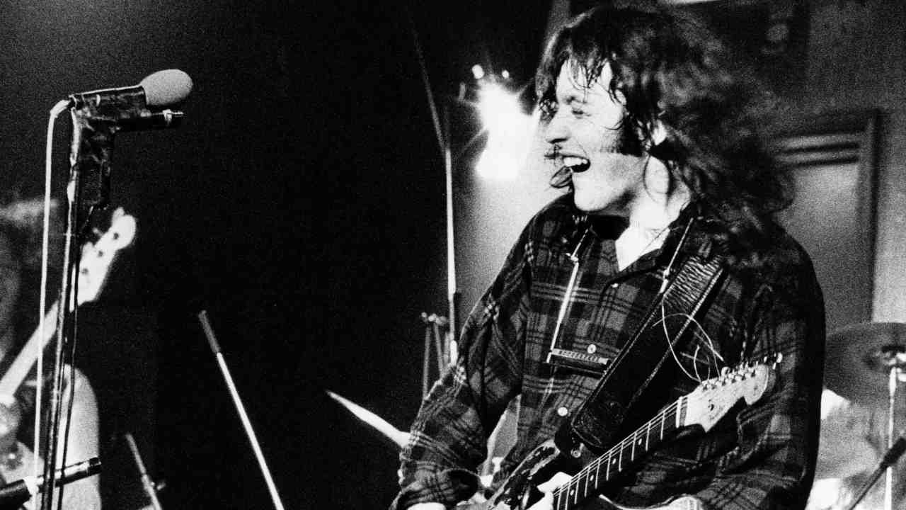 Rory Gallagher performing onstage with Taste in the late 1960s