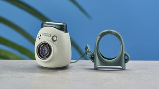 A pistachio green Fujifilm Instax Pal digital camera