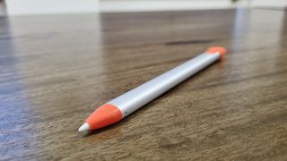 Logitech Crayon stylus on wooden desk