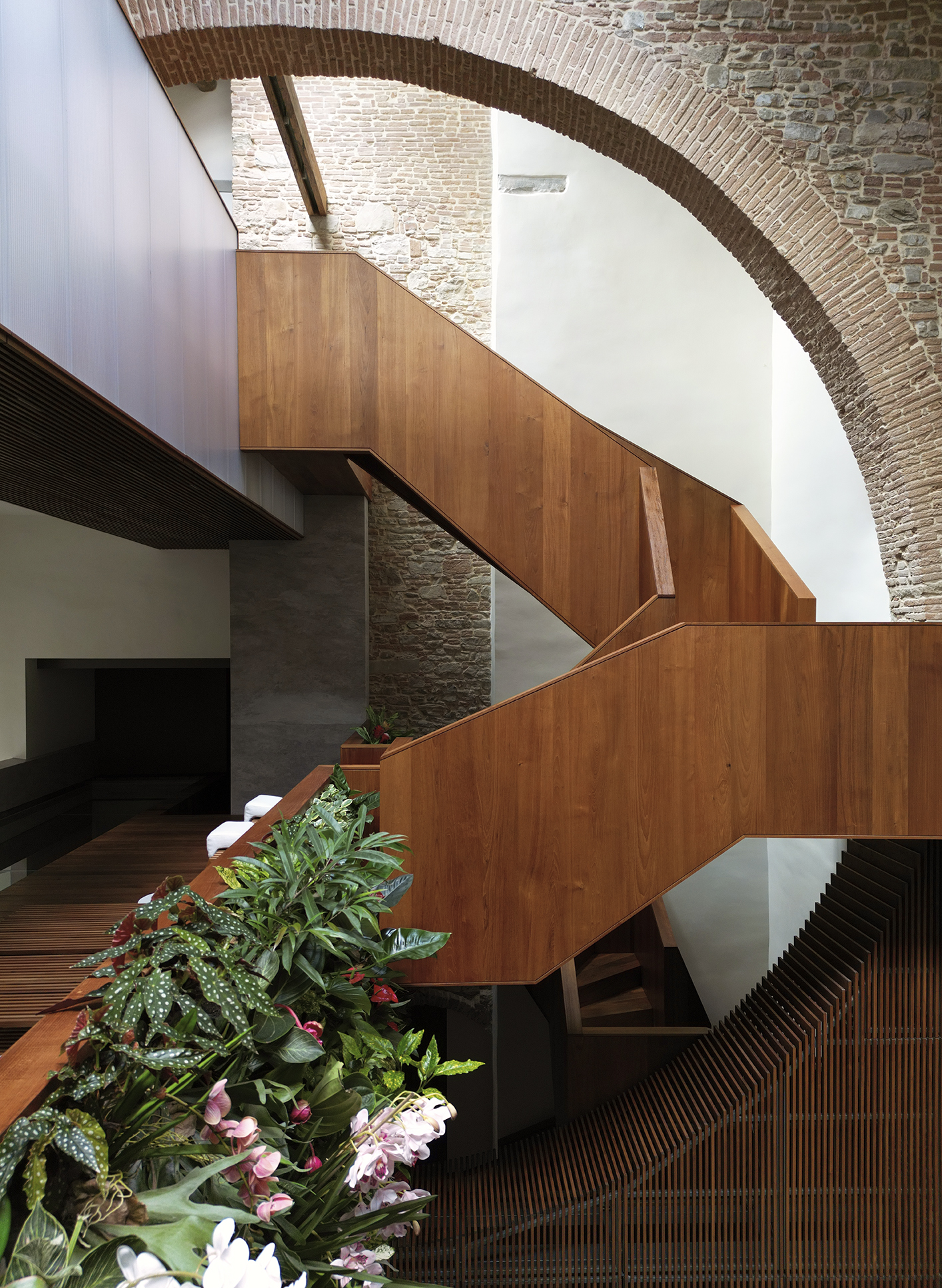 A new teak staircase is woven into the space