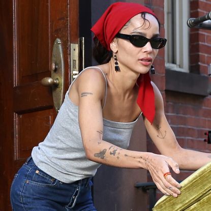 Zo&euml; Kravitz styled the red-and-gray color combination trend on the set of 'Die Alive' in NYC