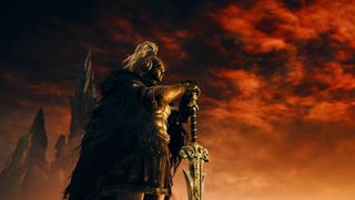 Man in golden hoplite armor with great sword on orange sky