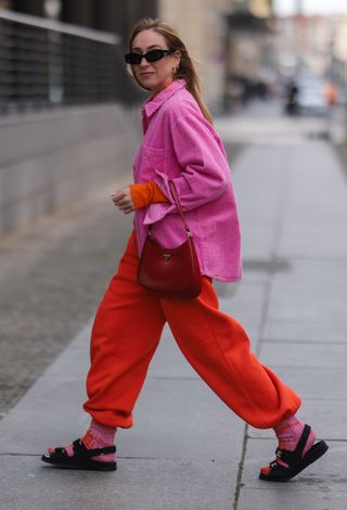 Woman wearing red sweatpants