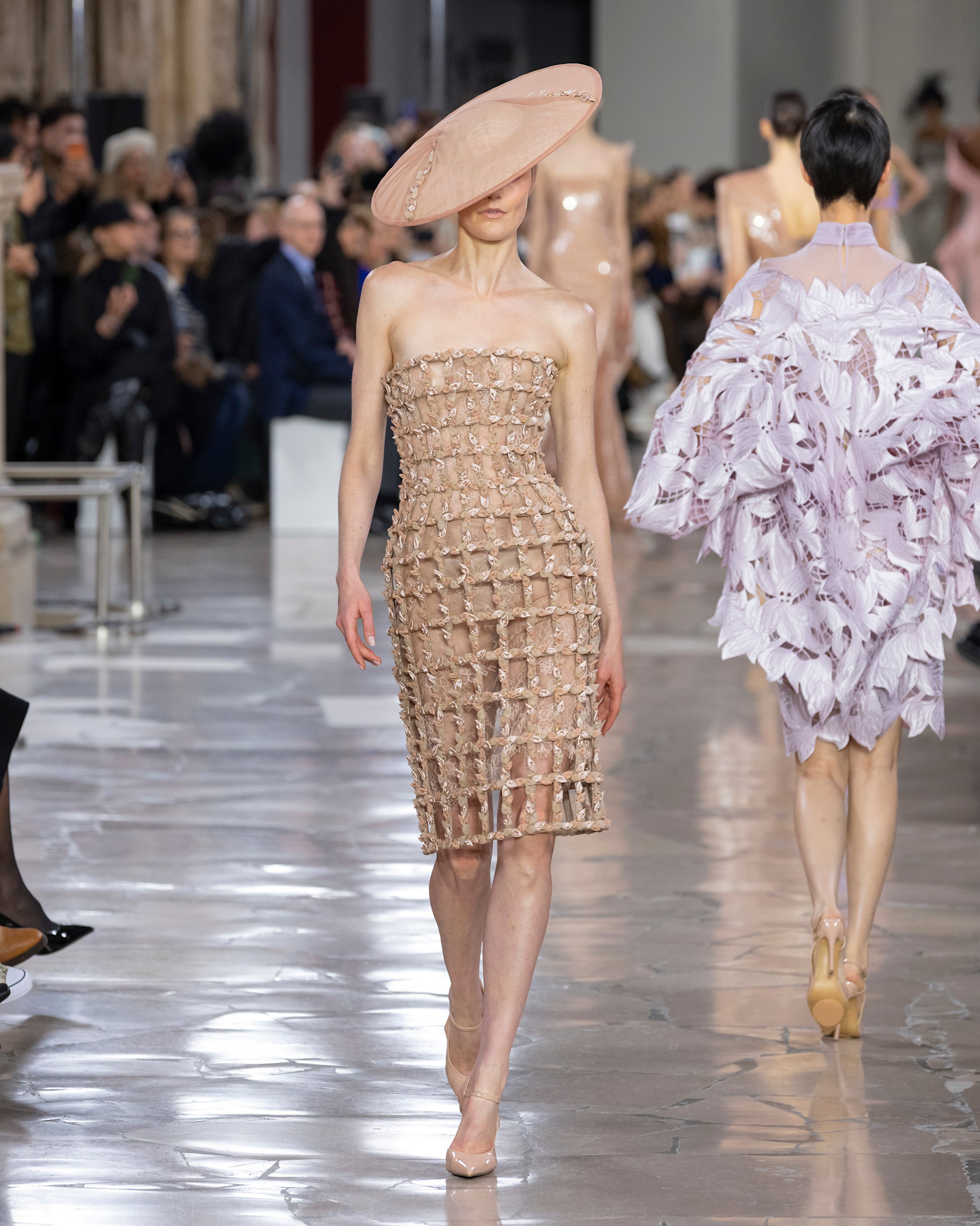 A model wore an oversize hat on the Georges Chakra Spring 2026 runway