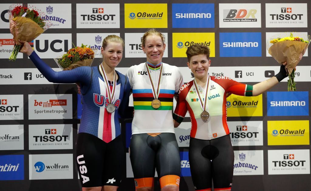 Gold medalist Netherlands Kirsten Wild C celebrates on the the podium with Silver medalist US Jennifer Valente L and Bronze medalist Portugals Maria Martins after the womens 10 km scratch race final at the UCI track cycling World Championship in Berlin on February 26 2020 Photo by Odd ANDERSEN AFP Photo by ODD ANDERSENAFP via Getty Images