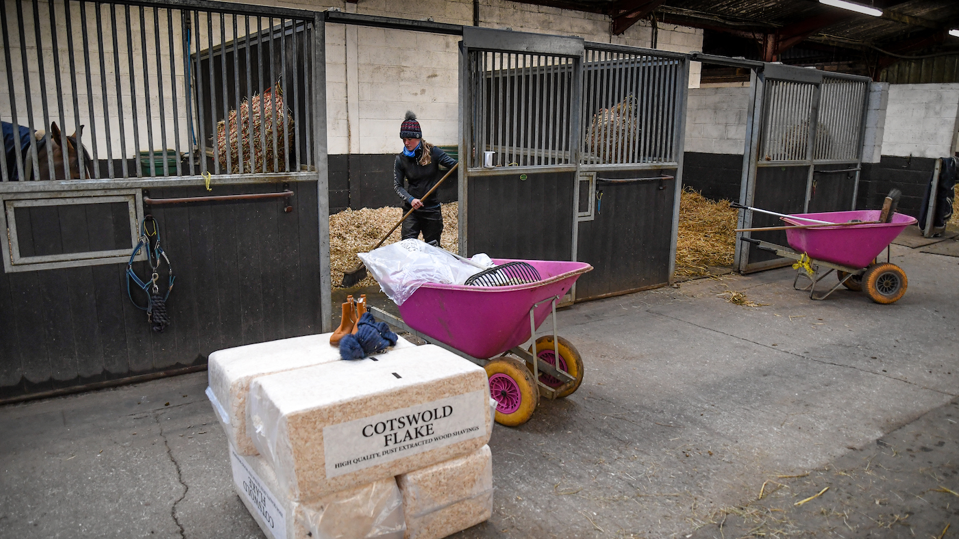 Tilly Hughes mucking out