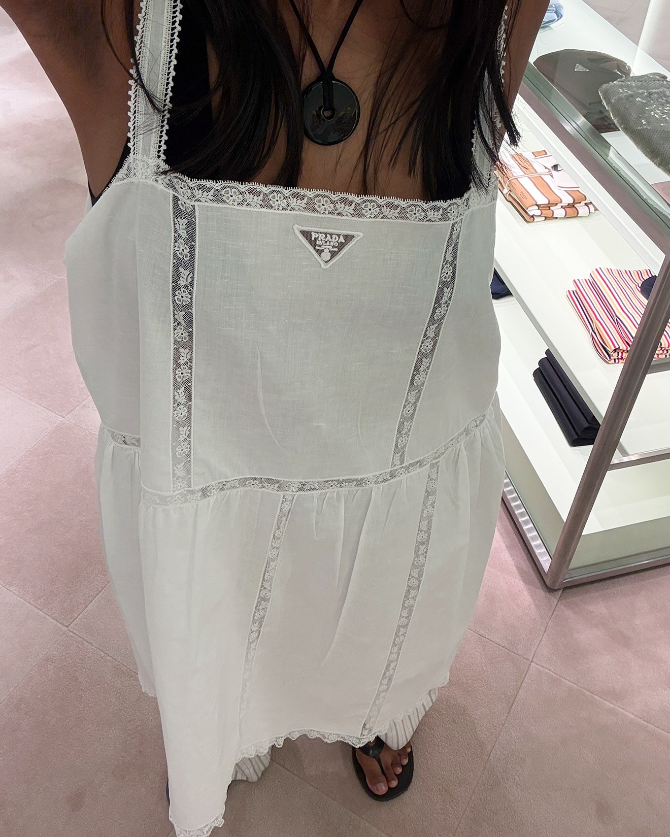 woman wears prada lace dress