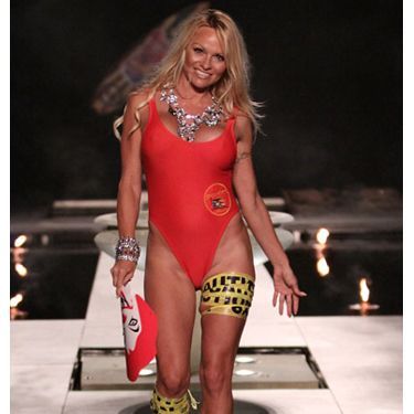 Pamela Anderson on catwalk wearing a swimsuit