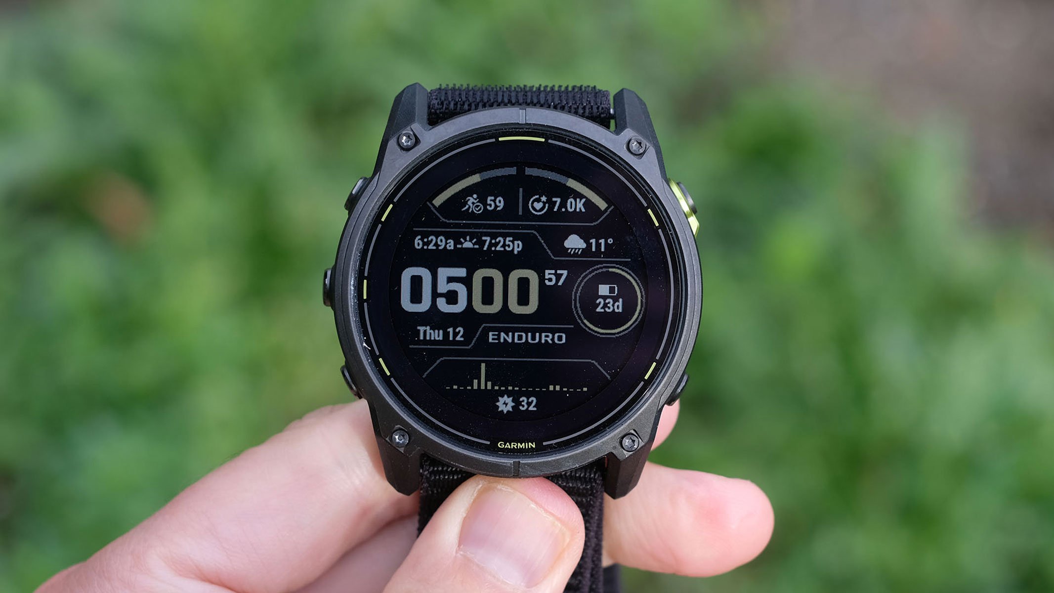 A close-up picture of our reviewer holding the Garmin Enduro 3 smartwatch in his hand