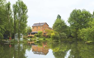 listed converted victorian mill house with lake