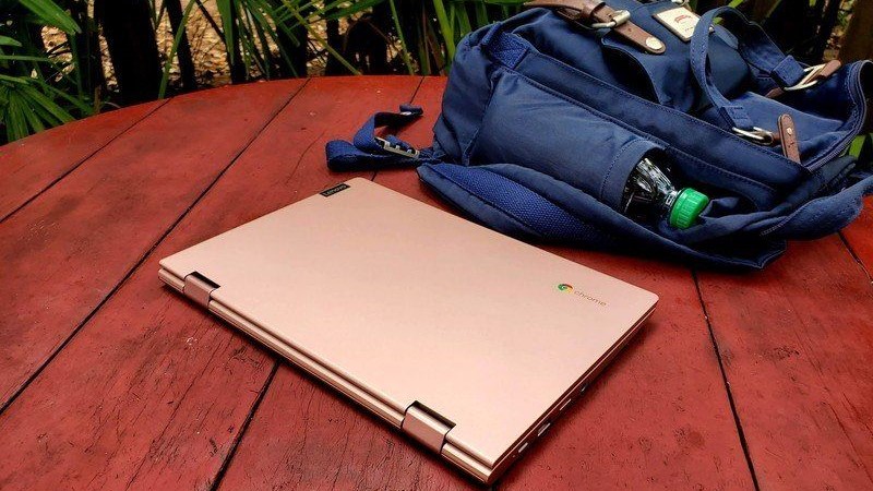 Chromebook next to backpack on table