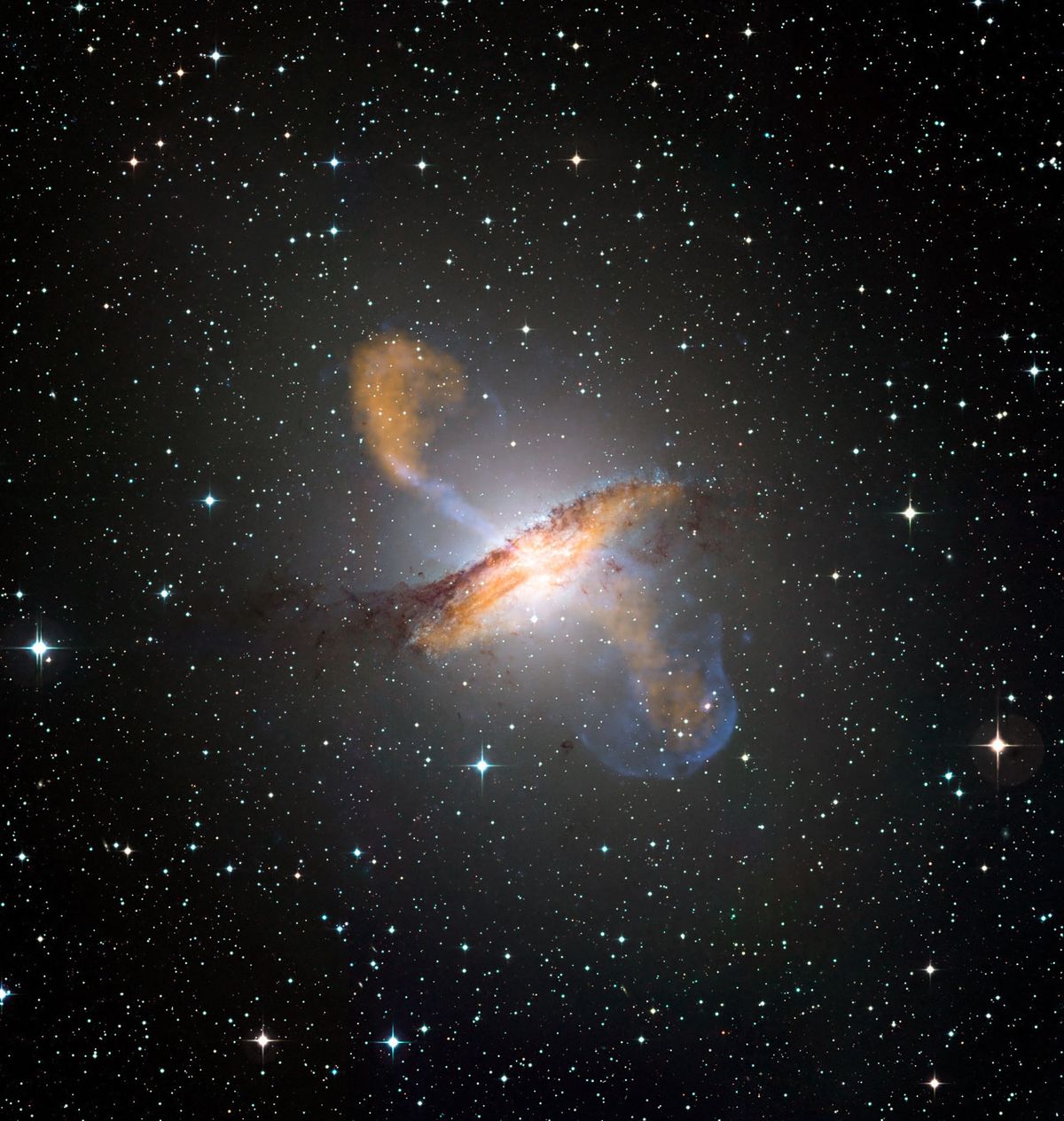 Merging X-ray data (blue) from NASA’s Chandra X-ray Observatory with microwave (orange) and visible images reveals the jets and radio-emitting lobes emanating from Centaurus A&#039;s central black hole. 