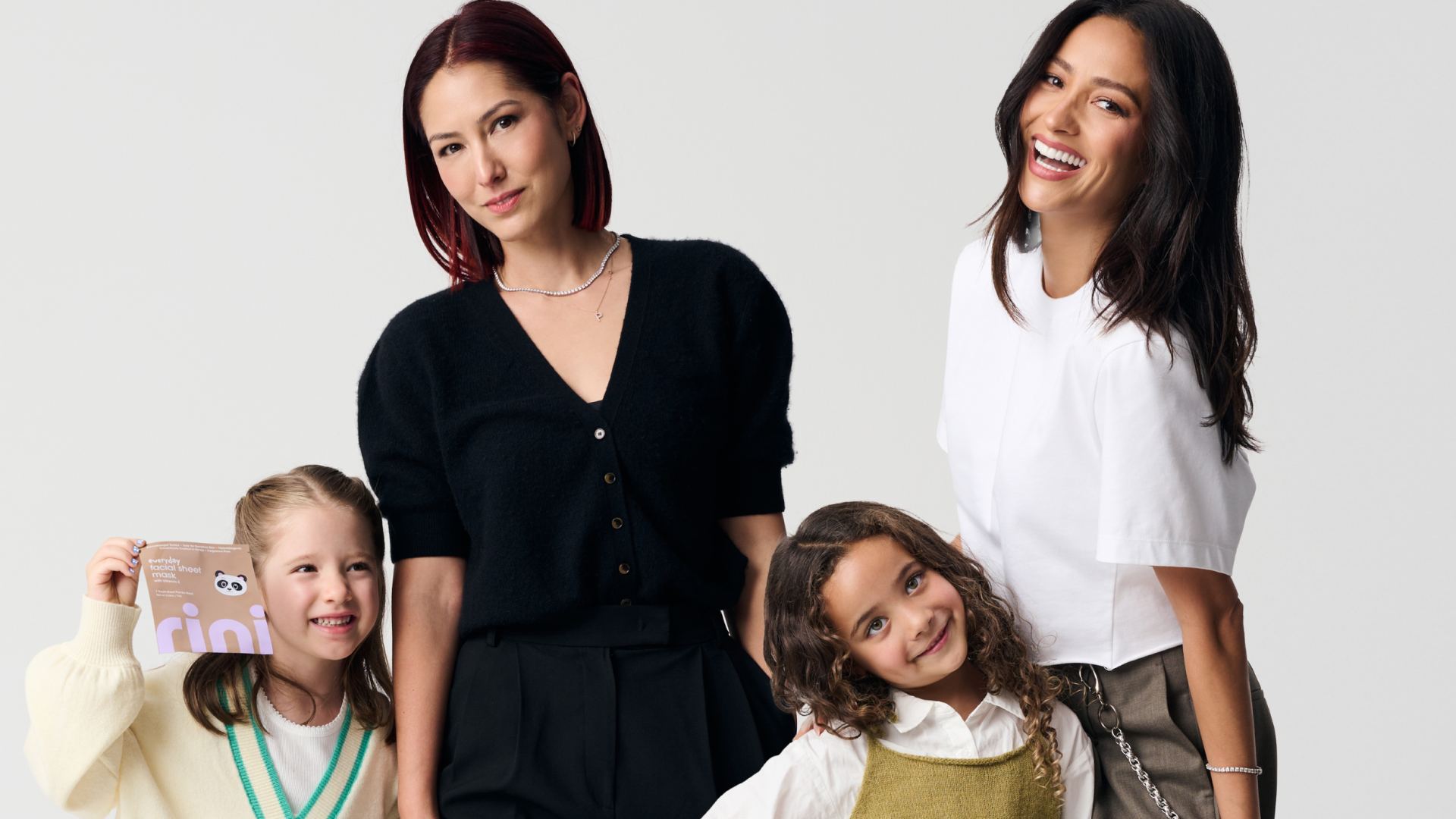 Rini co-founders Shay Mitchell and Esther Song posing with their children.