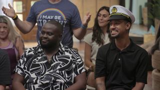 PJ and Anthony smiling in Jury Duty Presents Company Retreat