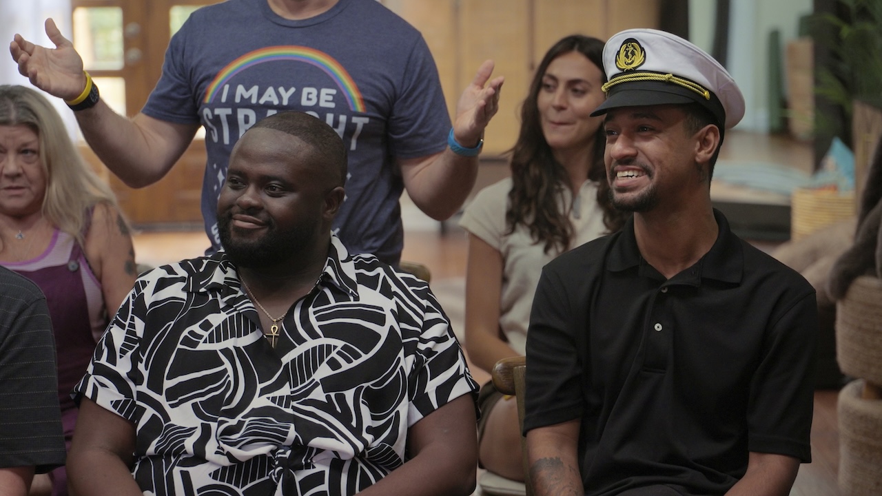 PJ and Anthony smiling in Jury Duty Presents Company Retreat