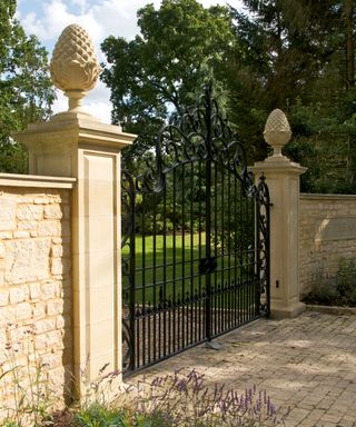 formal gates with finials from Haddonstone