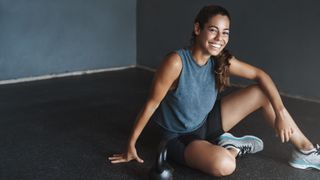 a photo of a happy woman in the gym