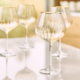 honey-tinged wine glasses with gold rim