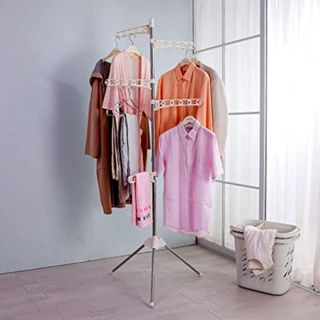 Grey drying rack with clothes hanging