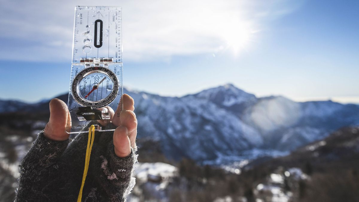 how to use a compass: compass and wintery background