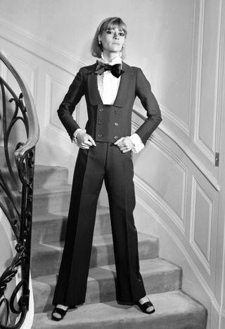 A model displays, 15 February 1967 in Paris, an alpaca dinner jacket spencer, jabot blouse and black silk bow-tie for Yves Saint Laurent 1967