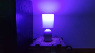 Philips Hue smart lamp set to purple.