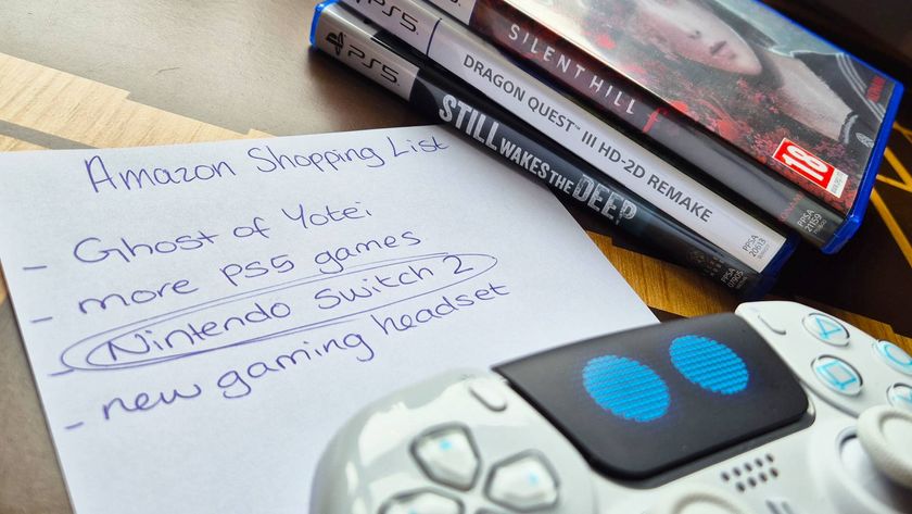 Photo of a hand-written shopping list on a table next to a pile of PS5 games and a DualSense controller.