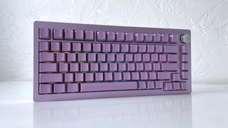 The Epomaker Tide 75 mechanical keyboard in lavender purple on a white table