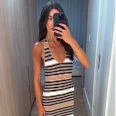 bianca wears a stripe maxi dress.