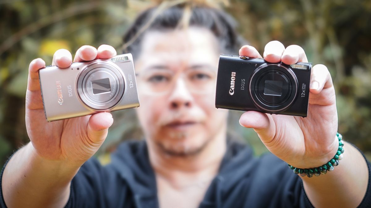 Canon PowerShot Elph 360 HS A / Canon Ixus 285 HS A in silver and black being held by photographer James Artaius